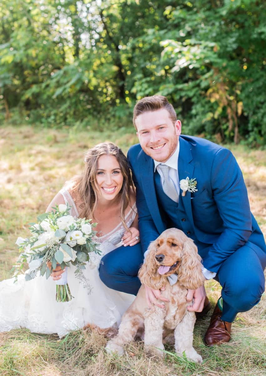 Dr Peter Wise with wife and dog at wedding